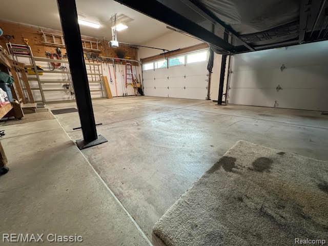 4435 Driftwood Dr, Commerce Twp, MI 48382 - garage with a garage door opener