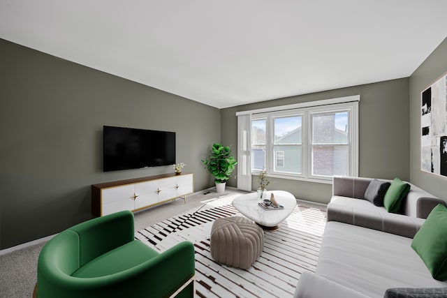 carpeted living room with baseboards