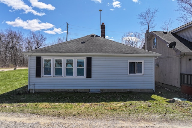 3931 S Shore Dr, Lapeer, MI 48446 - back of house with roof with shingles and a yard