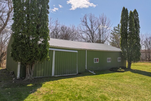 3931 S Shore Dr, Lapeer, MI 48446 - exterior space with a lawn, an outbuilding, an outdoor structure, and metal roof