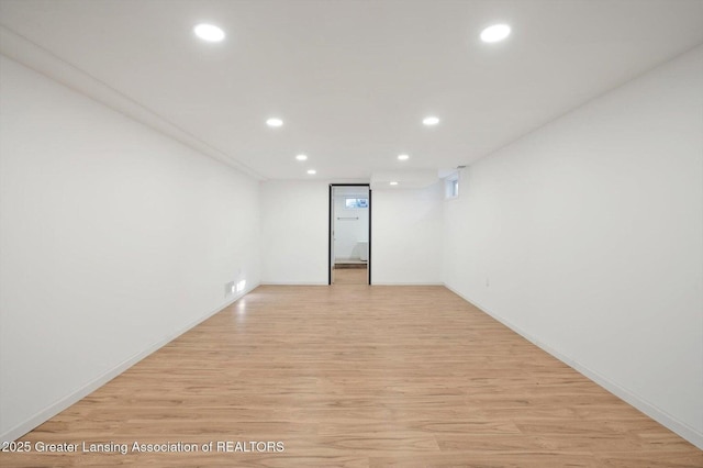 unfurnished room featuring light wood-type flooring and recessed lighting