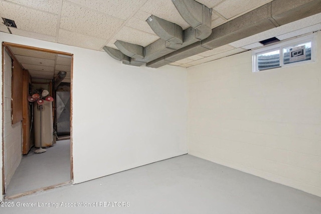 basement featuring a paneled ceiling