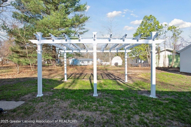 view of yard featuring a pergola and fence