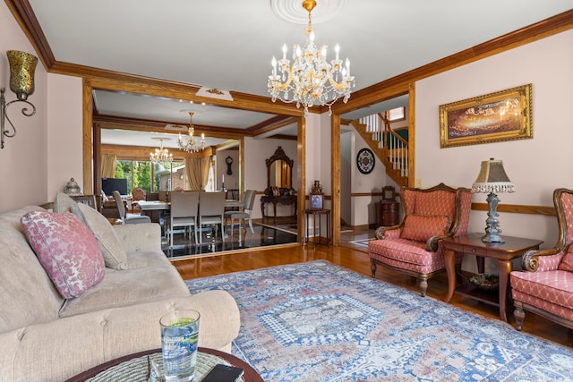 living room with stairway, a notable chandelier, wood finished floors, and crown molding