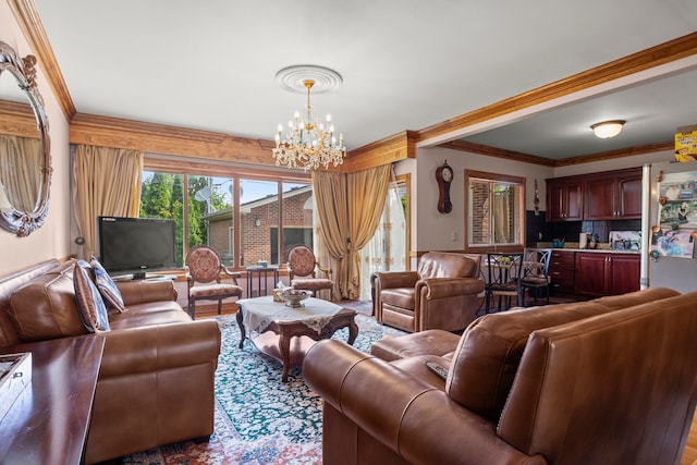 living area featuring an inviting chandelier and ornamental molding