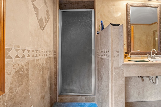 full bath with tile walls and a stall shower