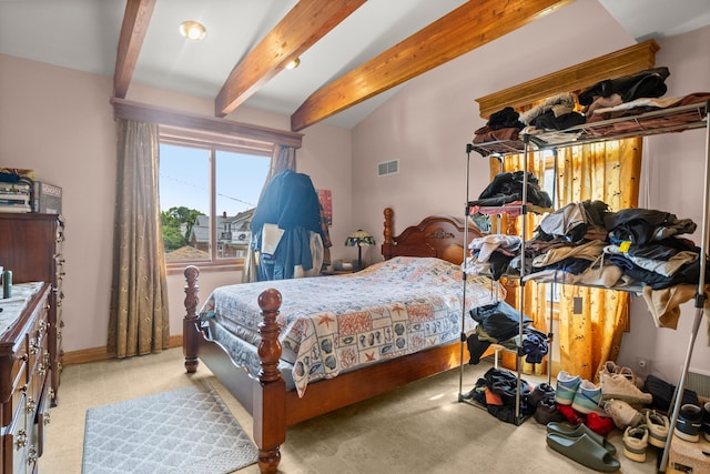 bedroom with baseboards, visible vents, beam ceiling, and light colored carpet