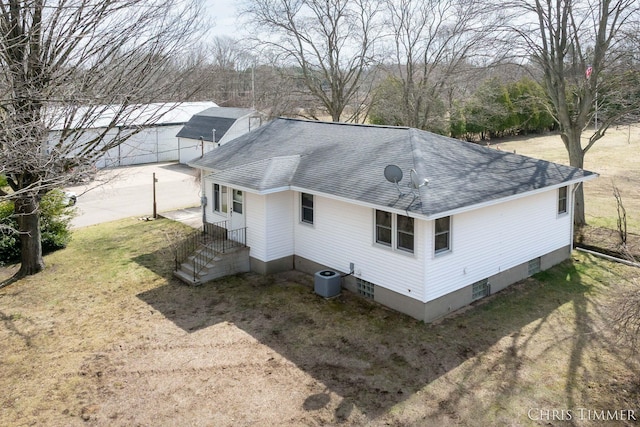15230 Van Buren St Unit B, Holland, MI 49424 - back of house with a lawn, roof with shingles, and central air condition unit