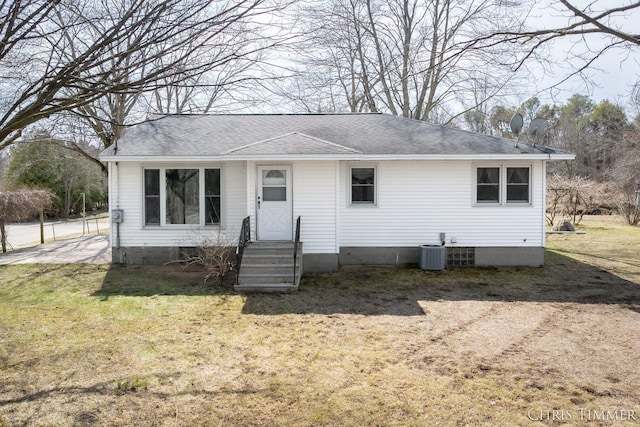 15230 Van Buren St Unit B, Holland, MI 49424 - view of front of house featuring roof with shingles, a front yard, and cooling unit
