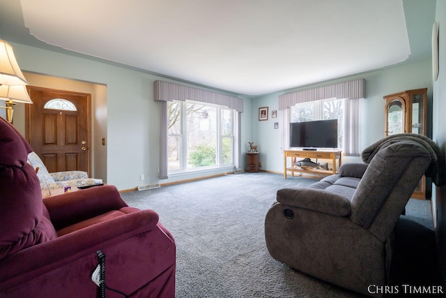 15230 Van Buren St Unit B, Holland, MI 49424 - living area with plenty of natural light, baseboards, visible vents, and carpet floors
