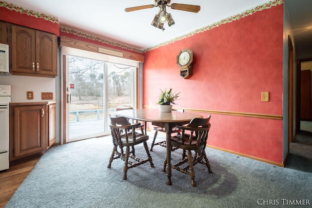 15230 Van Buren St Unit B, Holland, MI 49424 - dining space with ceiling fan, carpet floors, and baseboards
