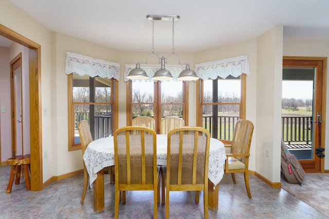 dining space featuring baseboards