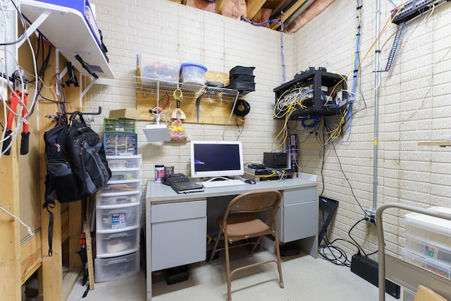 home office featuring finished concrete floors