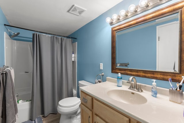 full bathroom featuring shower / tub combo, toilet, vanity, and visible vents