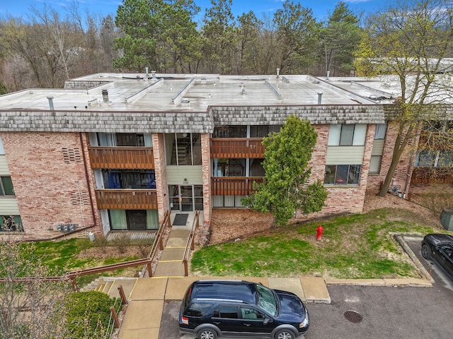 view of property featuring uncovered parking