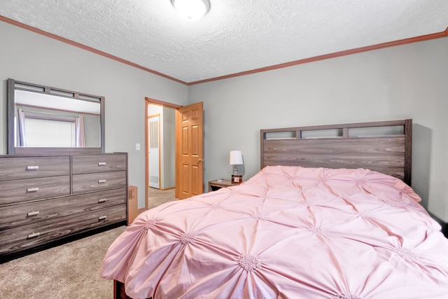 bedroom featuring ornamental molding, a textured ceiling, and carpet