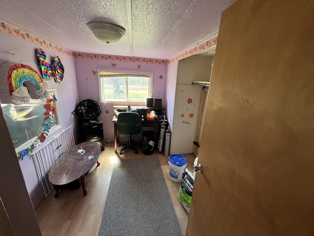 home office with wood finished floors
