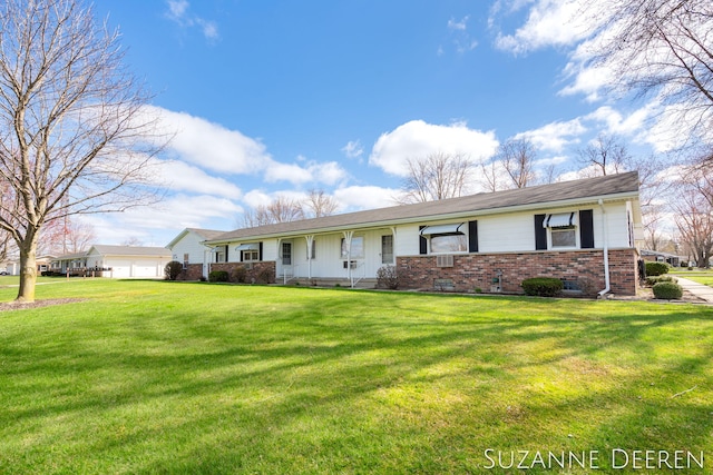 ranch-style house with brick siding and a front yard
