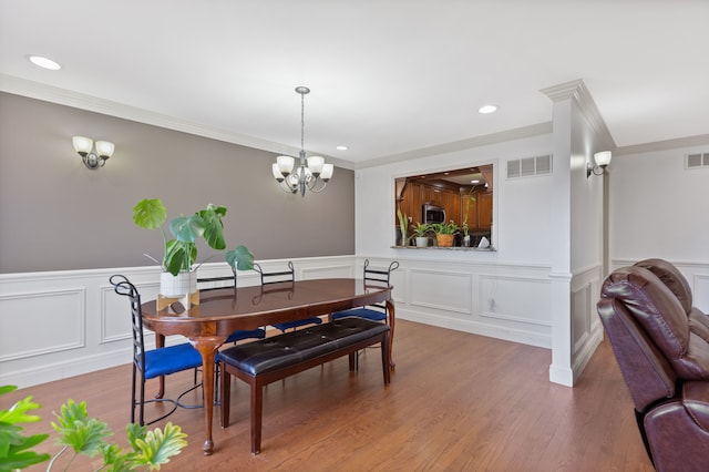 dining area featuring an inviting chandelier, ornamental molding, visible vents, and recessed lighting