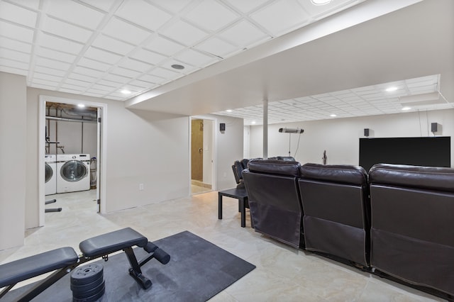 exercise area with washing machine and clothes dryer and recessed lighting