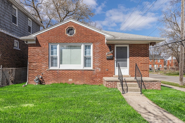 8911 Plainview Ave, Detroit, MI 48228 - bungalow with a front lawn, brick siding, and a shingled roof