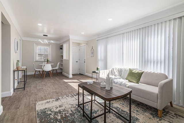 8911 Plainview Ave, Detroit, MI 48228 - living area with a chandelier, wood finished floors, baseboards, and recessed lighting