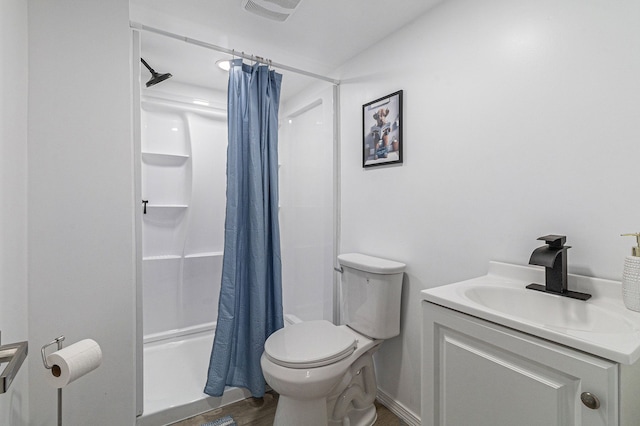8911 Plainview Ave, Detroit, MI 48228 - bathroom with wood finished floors, visible vents, toilet, vanity, and a shower with curtain
