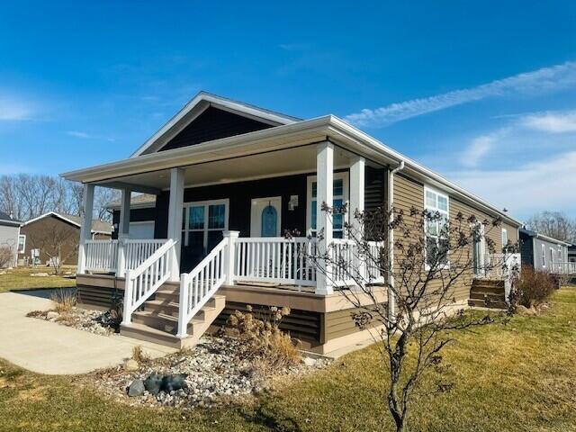 5652 Kingsley Dr NE, Rockford, MI 49341 - manufactured / mobile home with covered porch