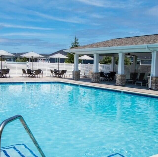5652 Kingsley Dr NE, Rockford, MI 49341 - community pool featuring fence and a patio area
