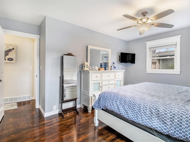 bedroom with baseboards, a ceiling fan, visible vents, and dark wood-style floors
