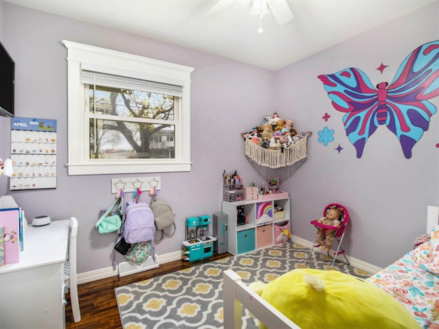 bedroom featuring baseboards, a ceiling fan, and wood finished floors