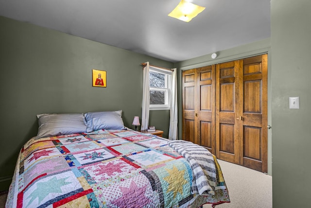carpeted bedroom with a closet