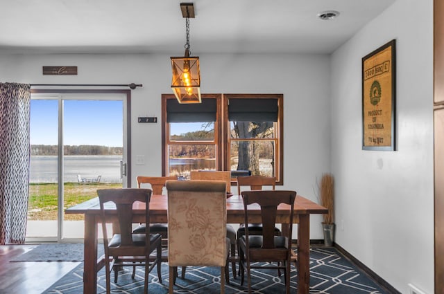 dining space with a water view