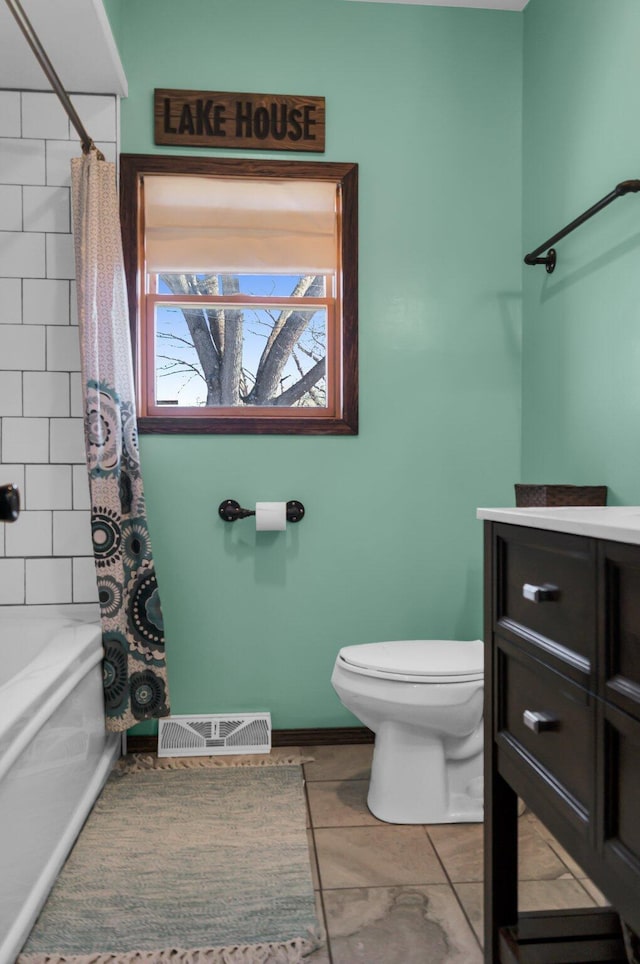 bathroom with toilet, shower / bath combo with shower curtain, tile patterned flooring, and visible vents