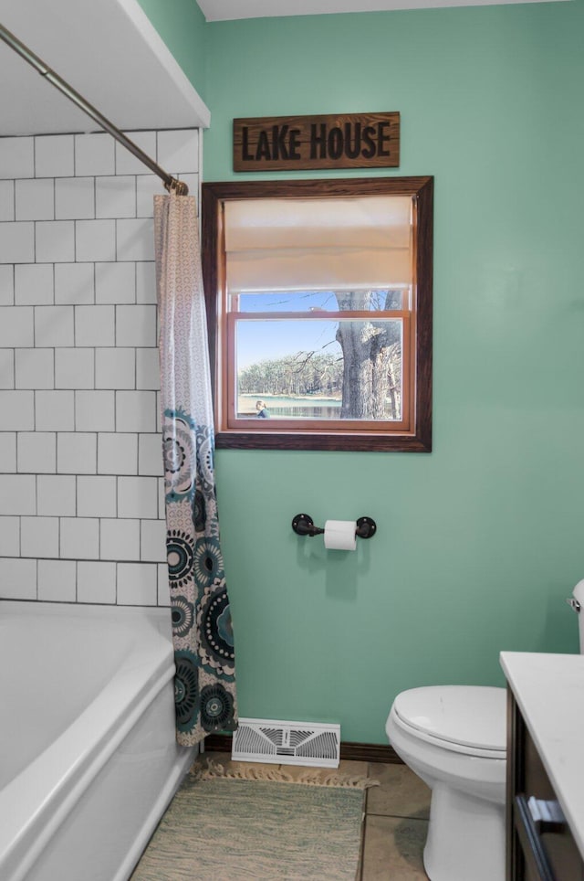 full bathroom featuring shower / bath combo, toilet, baseboards, visible vents, and vanity