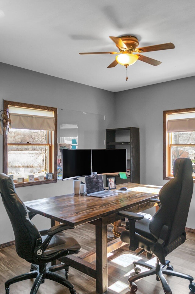 office area with wood finished floors and ceiling fan