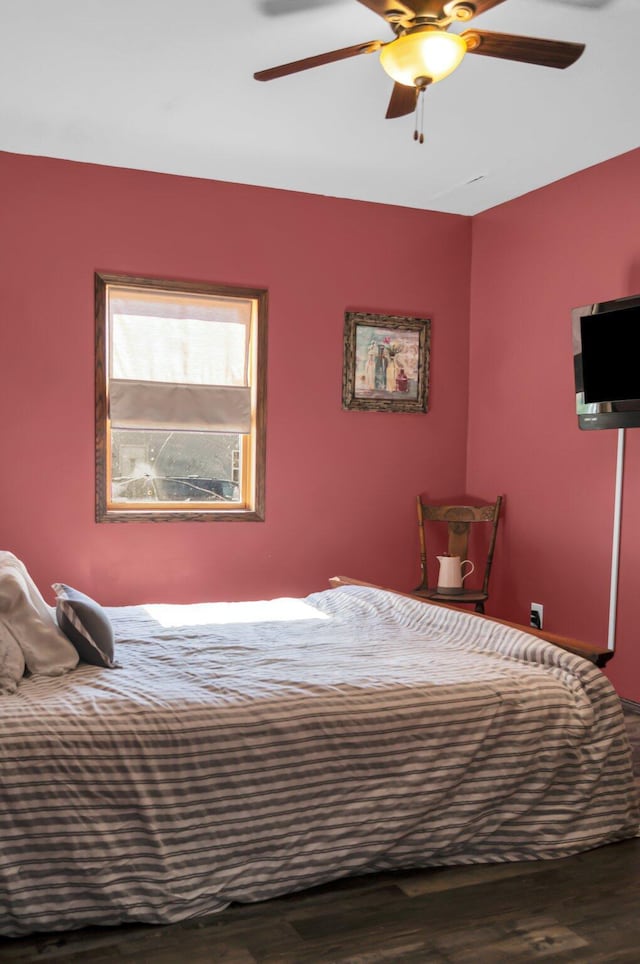 bedroom featuring wood finished floors and ceiling fan