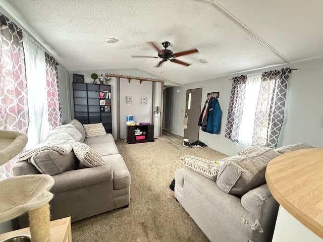 7006 Brides Bay Ct, Ira, MI 48023 - carpeted living area featuring a textured ceiling, ceiling fan, and vaulted ceiling