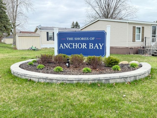 7006 Brides Bay Ct, Ira, MI 48023 - community sign with a yard