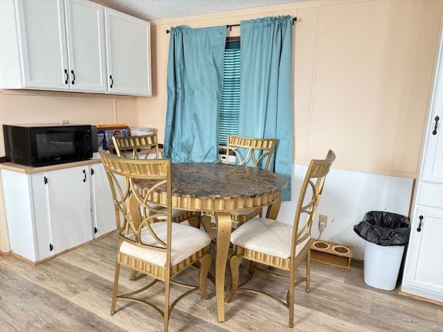 7006 Brides Bay Ct, Ira, MI 48023 - dining space featuring light wood-type flooring