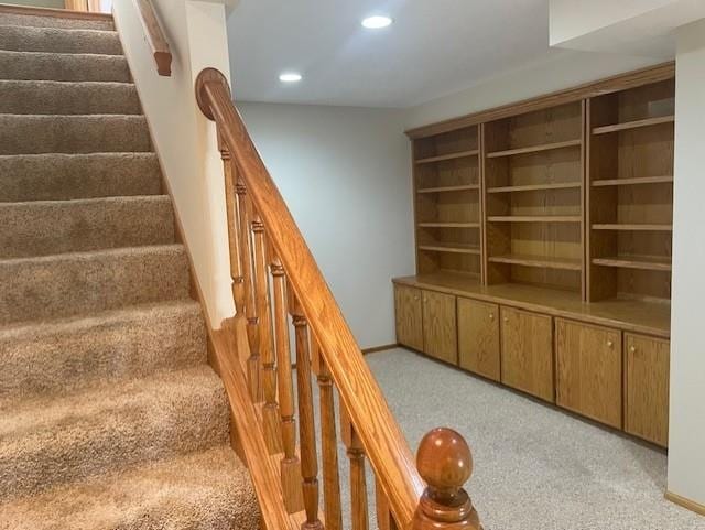 stairs with baseboards, carpet flooring, and recessed lighting