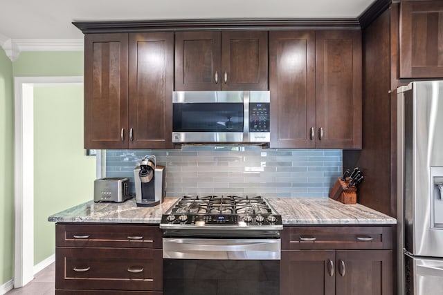 kitchen featuring crown molding, dark brown cabinets, and stainless steel appliances