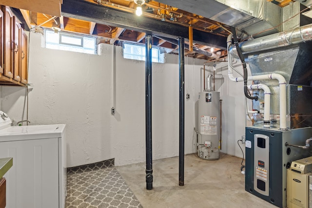 below grade area with heating unit, washer / dryer, and water heater