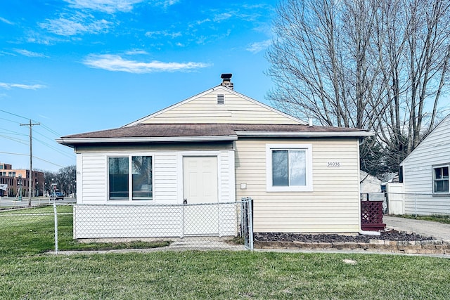 34038 Caseville Ct, Westland, MI 48186 - back of property featuring a lawn, fence, and roof with shingles