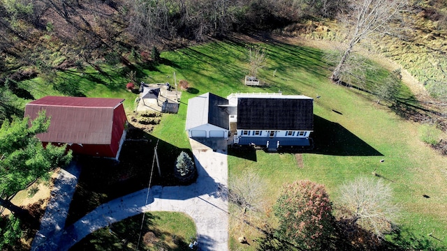 birds eye view of property with a rural view