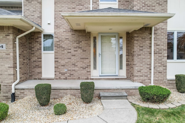 property entrance with brick siding