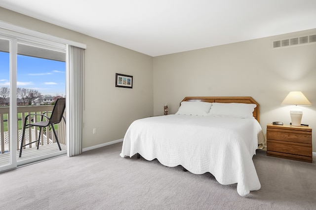 bedroom featuring baseboards, visible vents, carpet flooring, and access to exterior