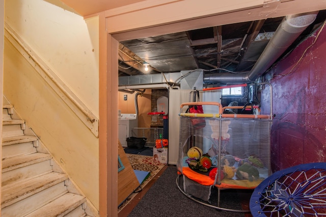 below grade area with washing machine and clothes dryer