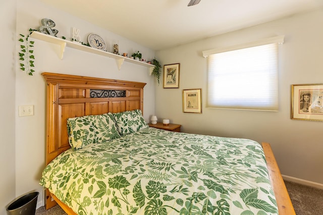 bedroom with baseboards and carpet flooring