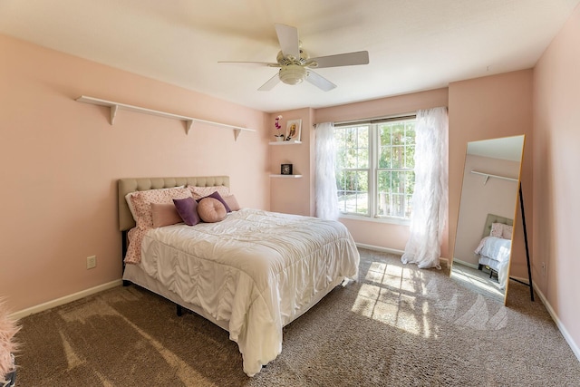 bedroom featuring baseboards, a ceiling fan, and carpet flooring